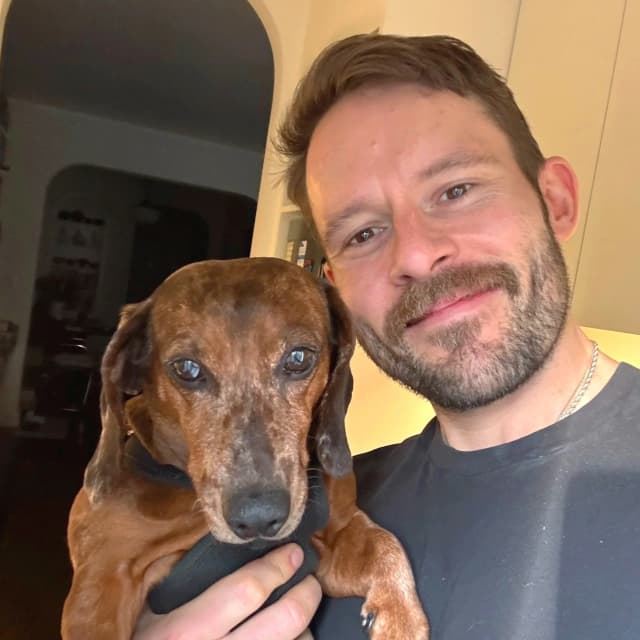 Stephen Tracy with his dachshund
